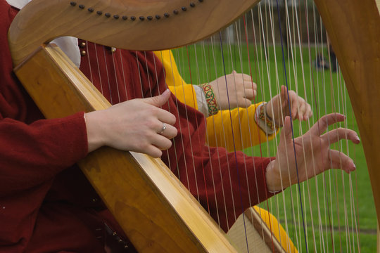 Harp strings close up hands