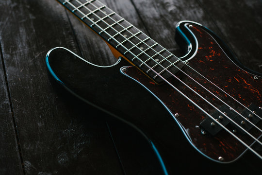 Electric guitar on a wooden surface. Conceptual background.