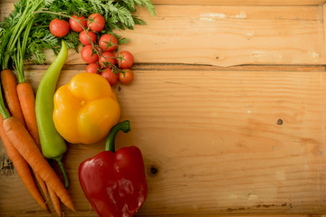Top view fresh vegetables with copy space on the right, on the rustic wooden surface