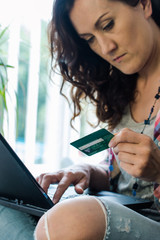 casual lady shopping online on laptop