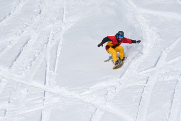 Fototapeta na wymiar Snowboarder riding on loose snow Freeride