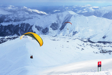 glider flying in mountainous terrain