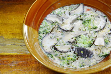 steamed egg fill mushroom and broccoli on bowl