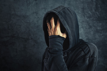 Hooded person fighting addiction crisis - obrazy, fototapety, plakaty
