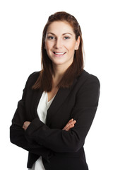 An attractive brunette businesswoman wearing a black suit and white shirt, standing with her arms crossed against white background.