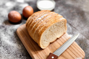 Ingredients for the preparation of bakery products. Bread, flour, eggs and cherry tomatoes.