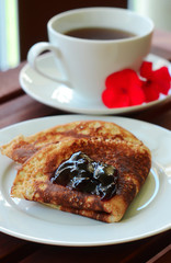 close-up Pancake  with marmalade and a cup of tea
