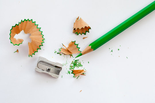 sharpener and green wooden pencil