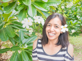 Asian woman is smiling. Glad, happy, joyful, cheerful, positive expression woman.