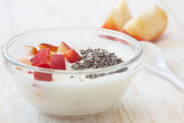 Yogurt with peach in  bowl