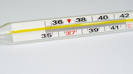 Medical glass mercury thermometer isolated
