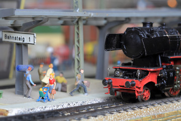 miniature model steam locomotive at station platform