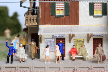 miniature figurine people waiting at a station platform - 70s