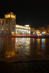 Yerevan republic square in night with arched building