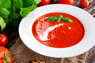 Smooth and sweet tomato soup, seasoned with basil, garlic.