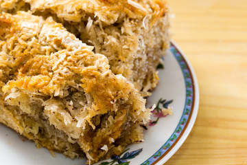 Close up of sliced coconut cake on plate