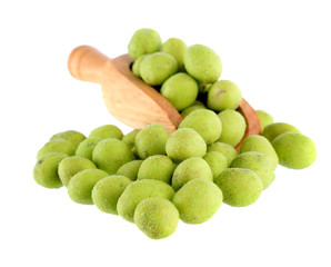 Wasabi coated peanuts in scoop on white background