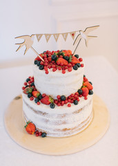 wedding cake. cake with fresh berries. cake with white cream and fresh berry.