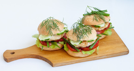 Tasty sandwiches on a wooden board