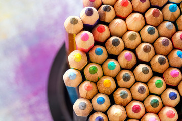 Colorful pencils on color background