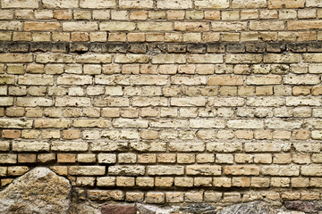 Old brick and stones wall fragment background texture