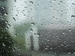 Selective focus, Raindrops on glass with city (raindrops,blur, rain)