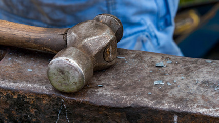 Detailed shot of metal being worked at a blacksmithing forge
