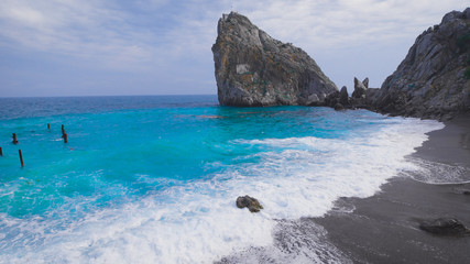 Sea shore. Waves rolled on the pebble beach