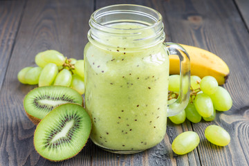 Healthy smoothie with kiwi, green grape, and banana in jar