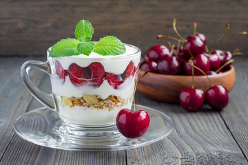 Cherry, muesli and yogurt dessert in glass, cherry verrine