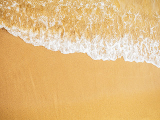 soft foam of wave reaching on the sea shore