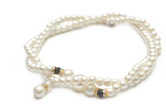 Beautiful pearl necklace on white