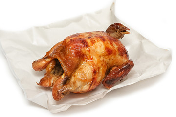 Roasted chicken on white paper
