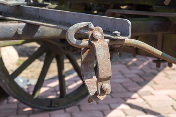 Old rusty forged metal elements. Parts of vintage horse wagon