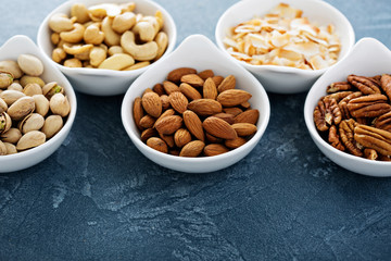 Variety of nuts in small bowls