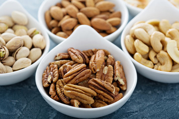 Variety of nuts in small bowls