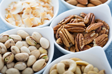 Variety of nuts in small bowls