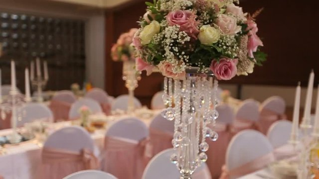 Interior of a wedding hall decoration ready for guests.Beautiful room for ceremonies and weddings.Wedding concept.Luxury stylish wedding reception purple decorations expensive hall