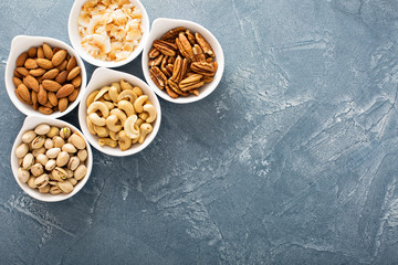 Variety of nuts in small bowls