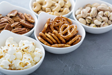 Variety of healthy snacks in white bowls - Powered by Adobe
