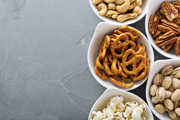 Variety of healthy snacks in white bowls - obrazy, fototapety, plakaty