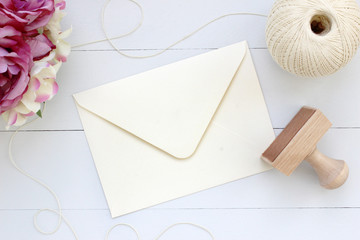 Mockup of envelope with a rubber stamp next to it. Modern trend template for advertising.