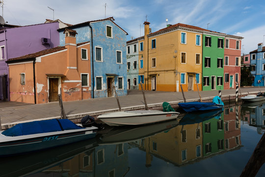 Venetian island of Burano is known for its brightly colored homes. The colors of the houses follow a specific system originating in the middle ages.