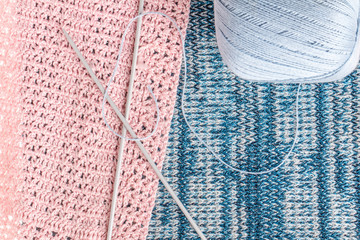 knitting needles on a background associated texture of yarn