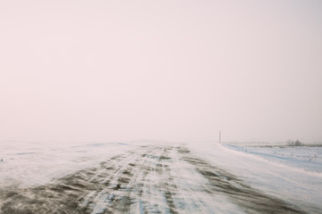 Snow-covered Road During A Snowstorm In Winter. Open Road,