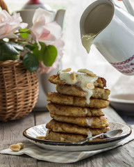 oat pancake with vanilla sauce, bananas,peanuts for Breakfast