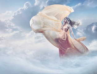 Fairy image of a beautiful young lady in the clouds
