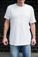 Muscular man wearing white blank t-shirt