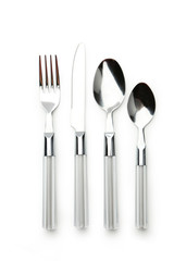 Fork, spoon and knife on white background