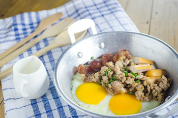 pan-fried egg with Chinese sausage, minced pork